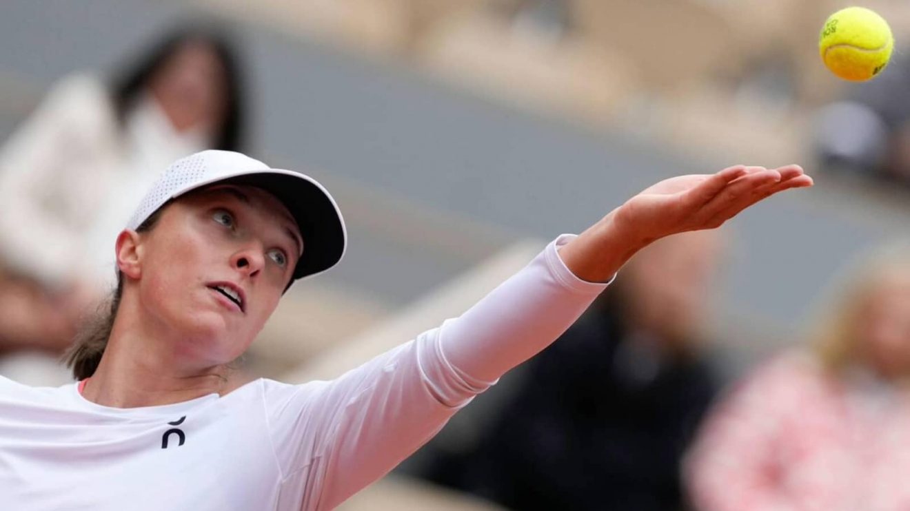 Poland's Iga Swiatek serves against Russia's Anastasia Potapova during their fourth round match of the French Open tennis tournament at the Roland Garros stadium in Paris, Sunday, June 2, 2024