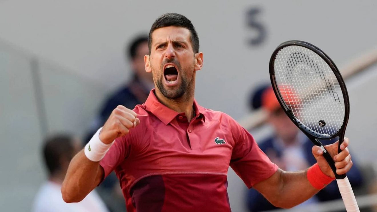 Serbia's Novak Djokovic clenches his fist after holding his service game and reaching 5-5 in the fourth set during his fourth round match of the French Open tennis tournament against Argentina's Francisco Cerundolo at the Roland Garros stadium in Paris