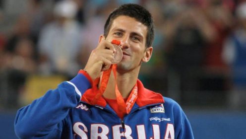 Serbia's Novak Djokovic displays his bronze medal won in singles tennis at the Beijing 2008 Olympics in Beijing