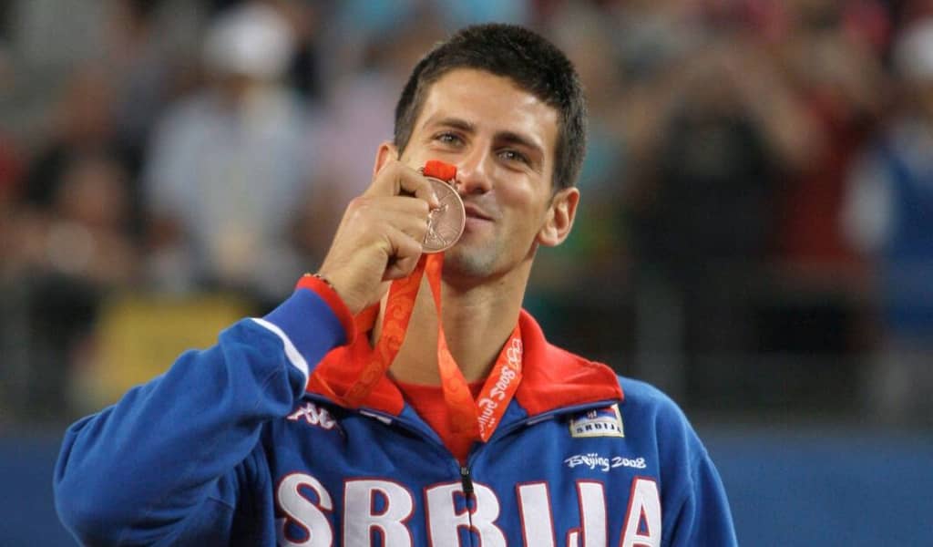 Serbia's Novak Djokovic displays his bronze medal won in singles tennis at the Beijing 2008 Olympics in Beijing