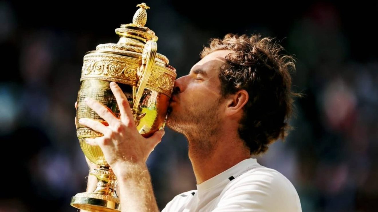 Andy Murray kisses the Wimbledon trophy