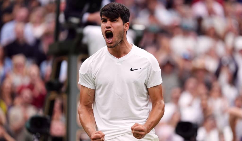 Carlos Alcaraz celebrates a victory at Wimbledon in 2024