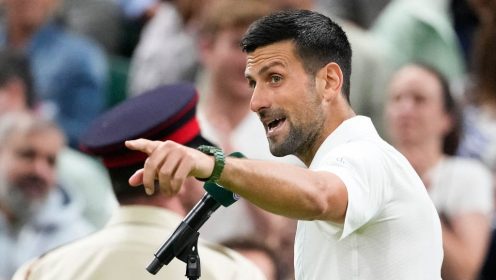 Novak Djokovic pointing during on-court interview