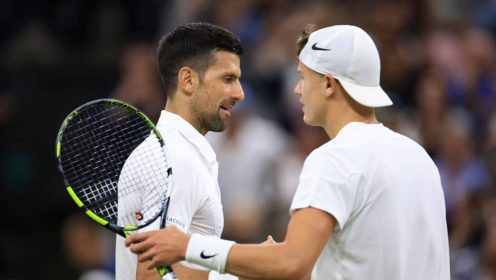 Novak Djokovic and Holger Rune shake hands after their match at Wimbledon in 2024