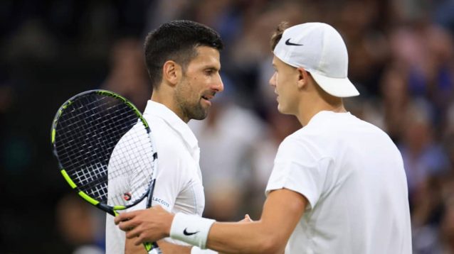 Novak Djokovic and Holger Rune shake hands after their match at Wimbledon in 2024