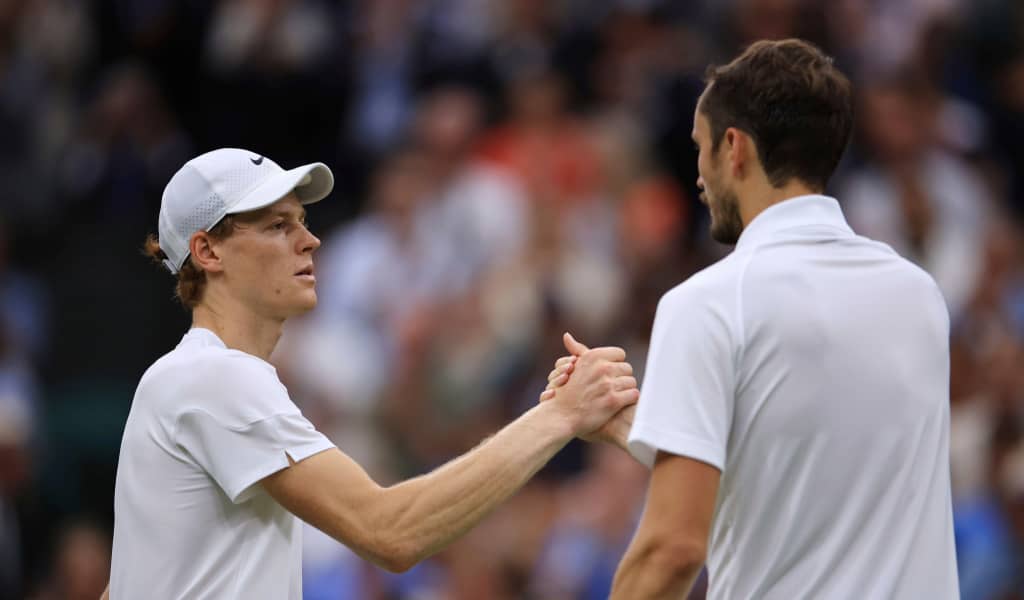 Jannik Sinner and Daniil Medvedev shake hands after their Wimbledon 2024 match