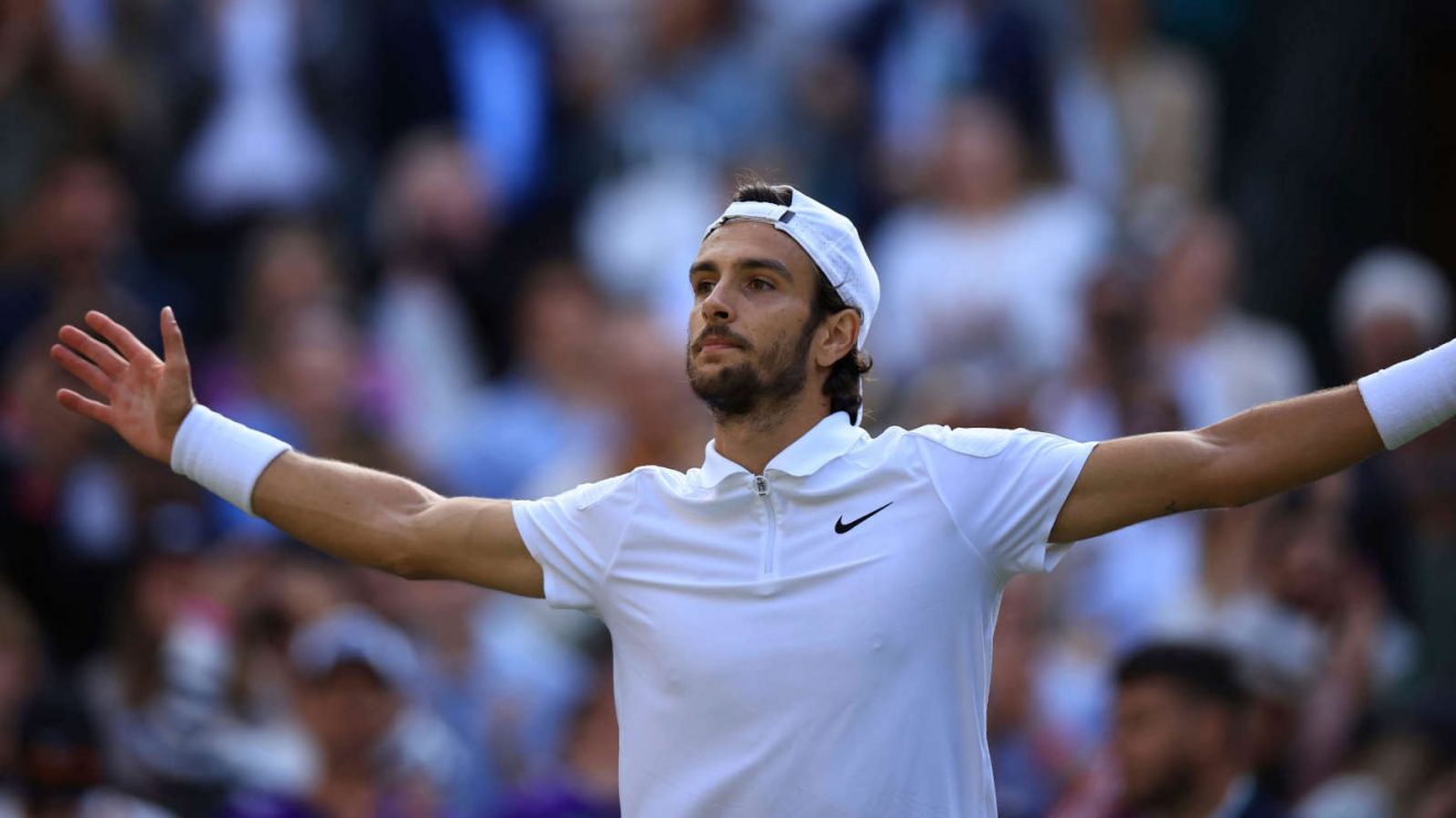 Lorenzo Musetti celebrates victory at Wimbledon