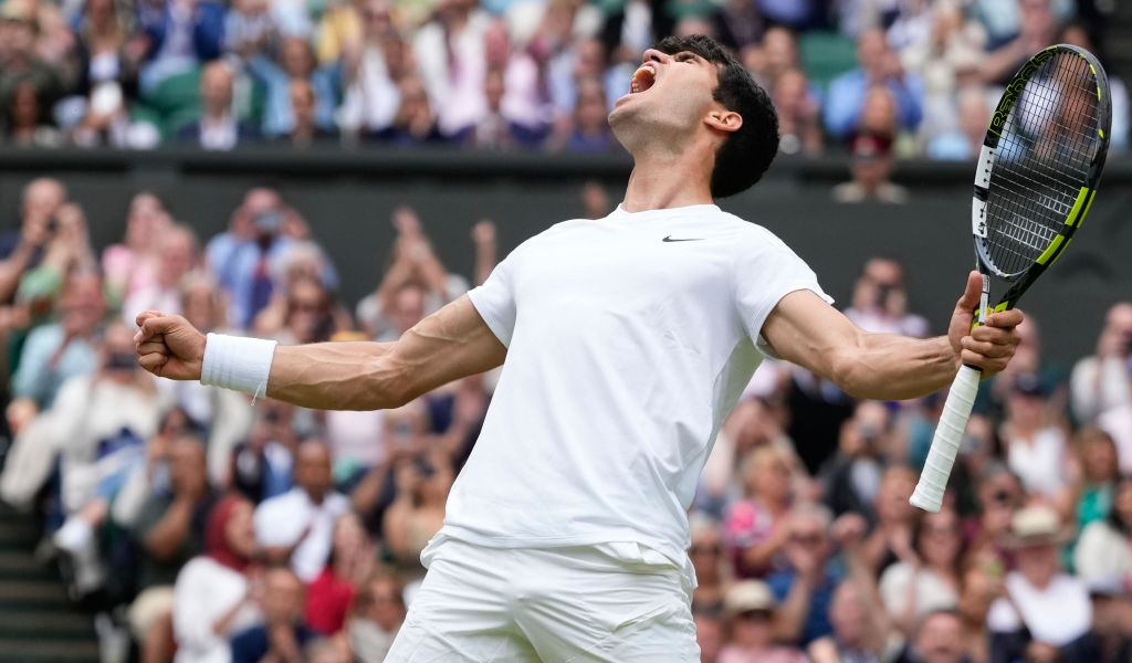 Carlos Alcaraz celebrates another Wimbledon win