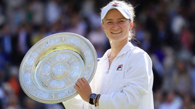 Wimbledon champion Barbora Krejcikova lifts the Venus Rosewater Dish