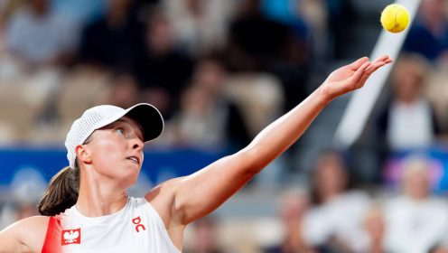 Iga Swiatek serves at the 2024 Paris Olympics
