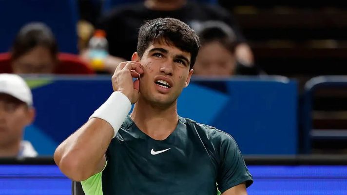 Carlos Alcaraz looks up during his match