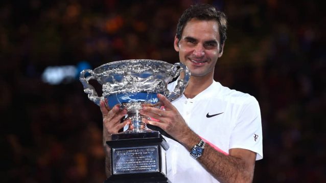 Roger Federer lifting the trophy at the 2018 Australian Open