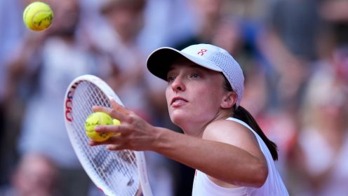 Pictured: Iga Swiatek hits balls into the crowd at Paris 2024