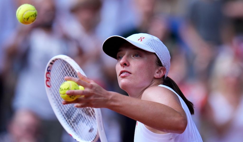 Pictured: Iga Swiatek hits balls into the crowd at Paris 2024