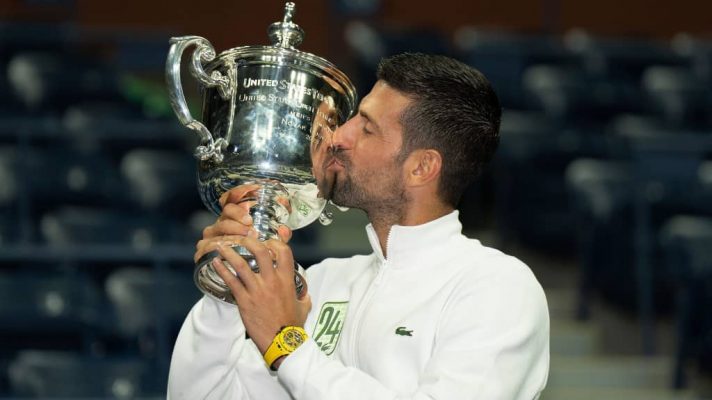Novak Djokovic kisses the US Open trophy in 2023