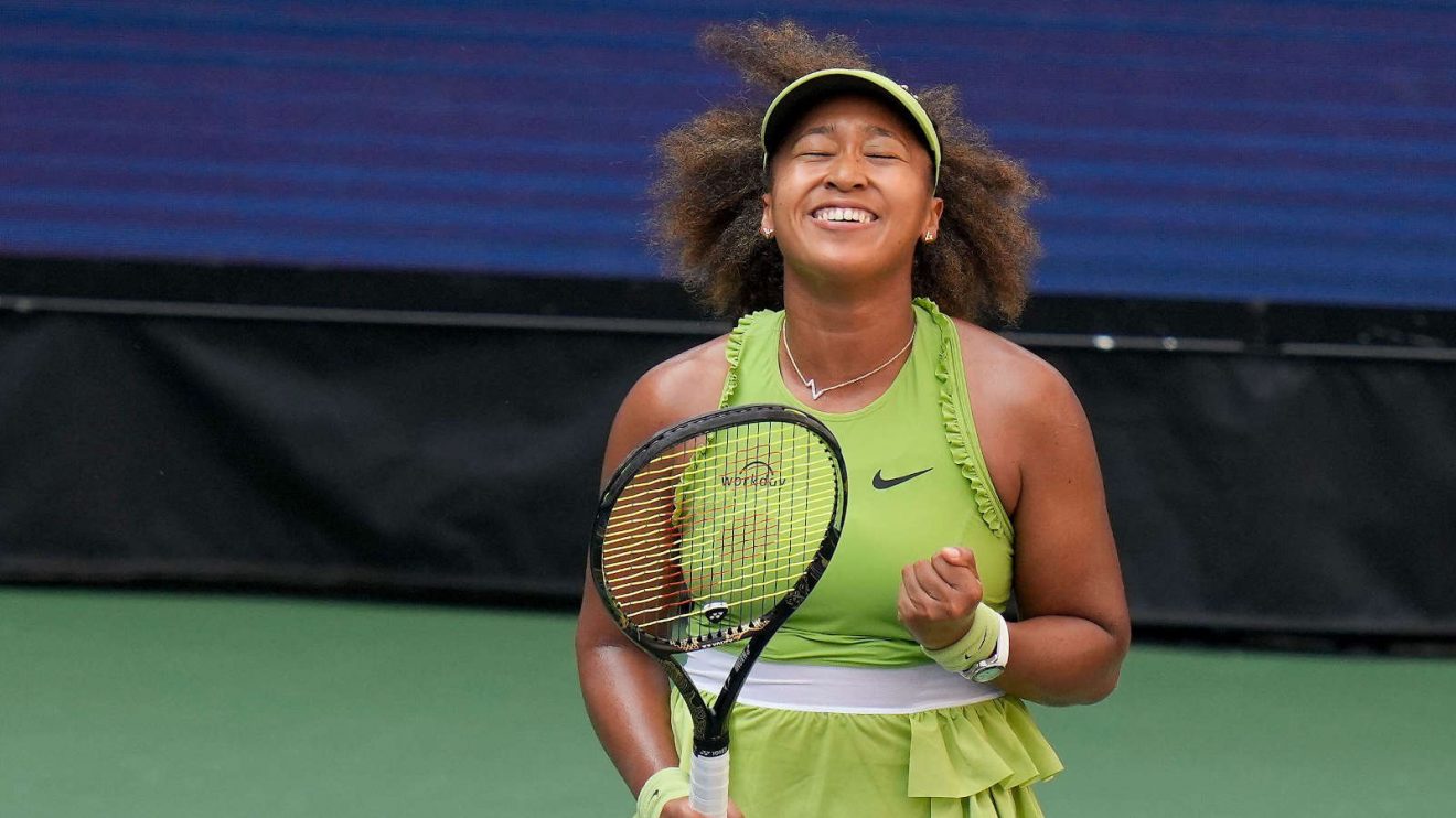 Naomi Osaka celebrates after winning