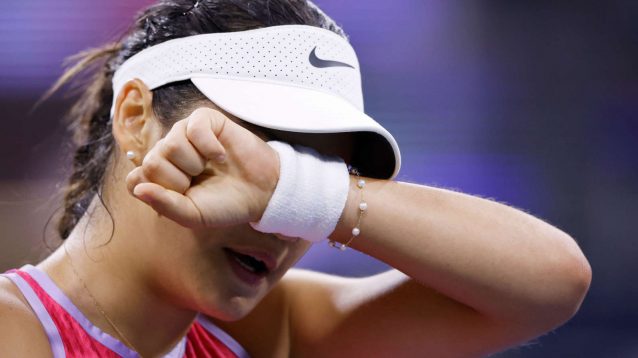 Emma Raducanu wipes her face