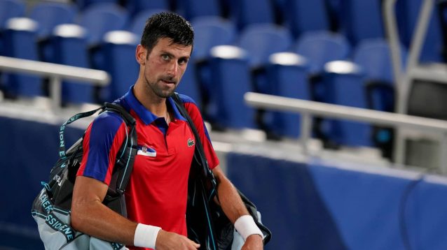 Novak Djokovic leaves the court after his semi-final loss to Alexander Zverev at the Tokyo Olympics