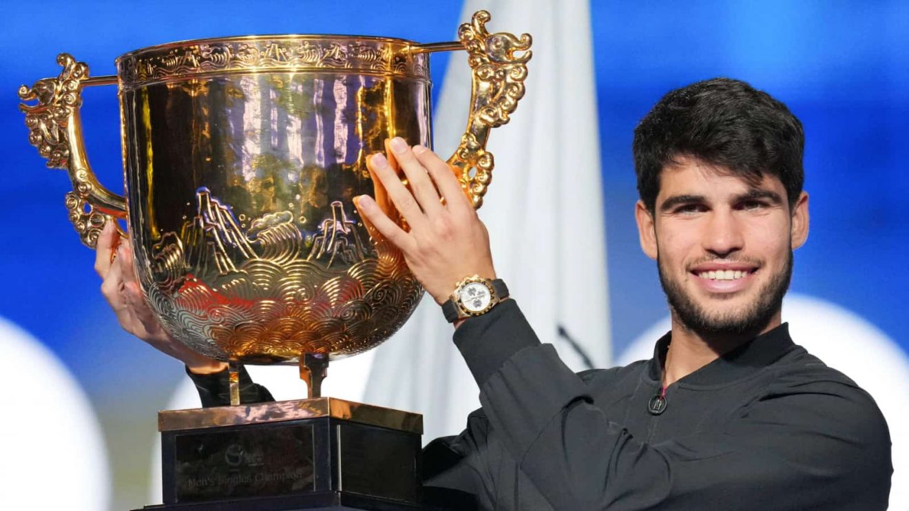 Carlos Alcaraz celebrates with the China Open trophy in Beijing