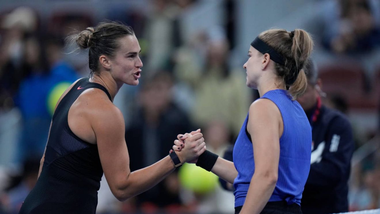 Aryna Sabalenka and Karolina Muchova shake hands after their China Open match