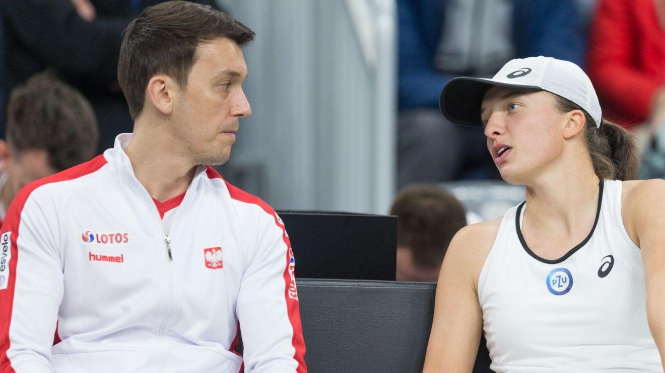 Pictured: Iga Swiatek and Poland BJK Cup captain Dawid Celt.