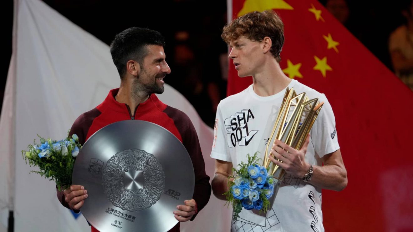 Novak Djokovic and Jannik Sinner chat during the Shanghai Masters trophy ceremony