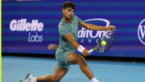 Carlos Alcaraz plays a shot