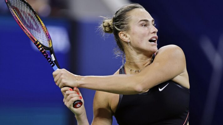 Pictured: Aryna Sabalenka hits a backhand.