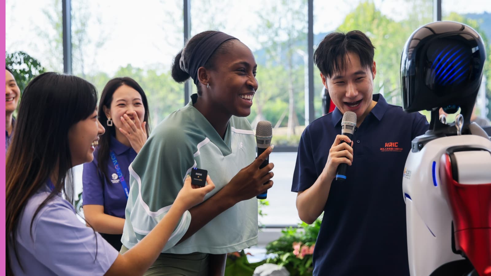 Coco Gauff with a robot