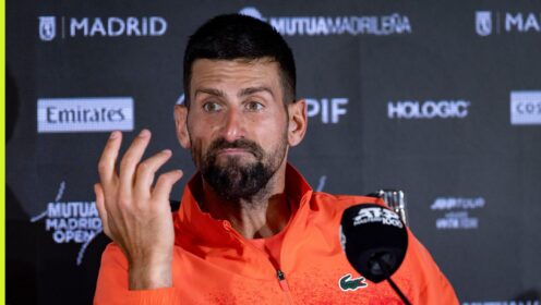 Pictured: Novak Djokovic talks to the media