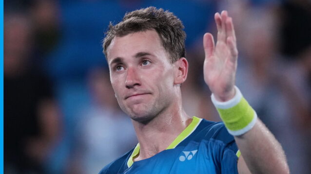 Pictured: Casper Ruud waves to the crowd after a win.