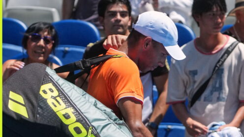 Pictured: Felix Auger-Aliassime walks off court.