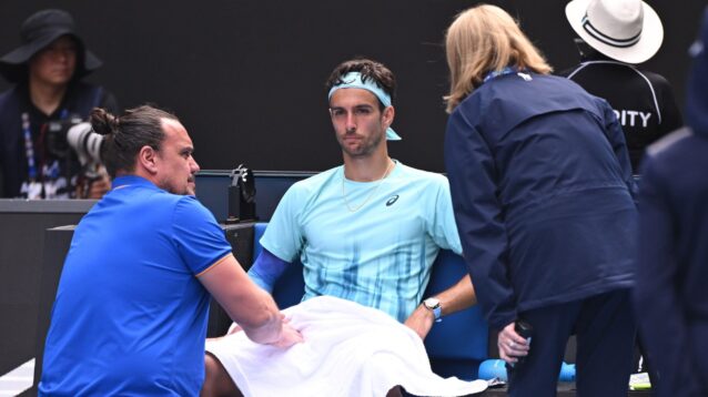 Lorenzo Musetti receives treatment.