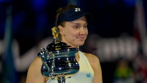 Pictured: Elena Rybakina smiles while holding the Australian Open trophy.