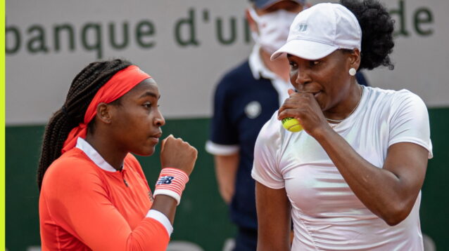 Pictured: Coco Gauff and Venus Williams talk while playing doubles.