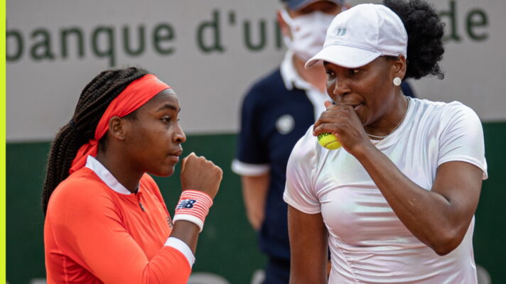 Pictured: Coco Gauff and Venus Williams talk while playing doubles.