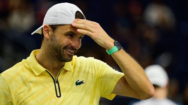 Pictured: Grigor Dimitrov smiles during a match.