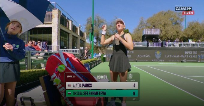 A screenshot from a WTA broadcast feed showing the Russian flag next to Oksana Selekhmeteva's name.