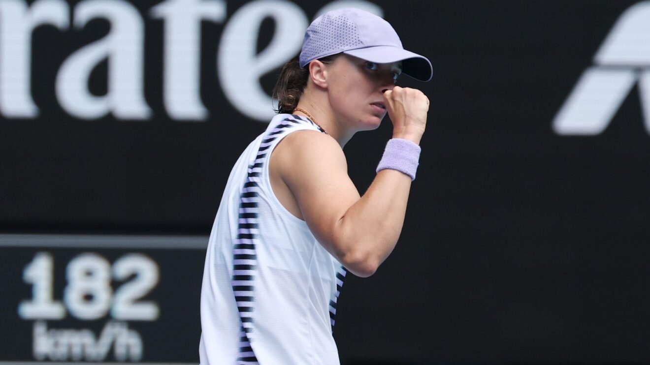 Pictured: Iga Swiatek fistpumps during a match.