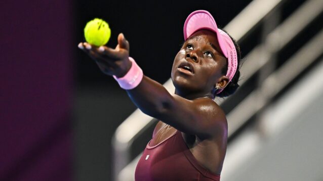 Pictured: Victoria Mboko tosses the ball during her service motion.