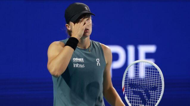 Pictured: Iga Swiatek reacts during a match.