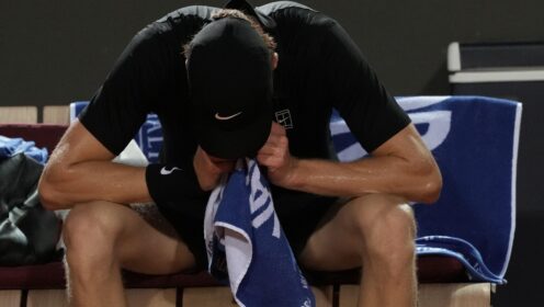 Jannik Sinner with his head in his hands at the Italian Open