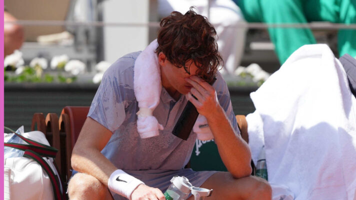 Pictured: Jannik Sinner feeling the heat during his match