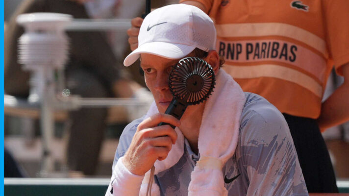 Pictured: Jannik Sinner tries to cool down with a handfan