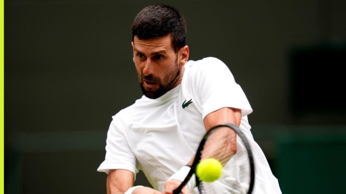 Novak Djokovic hits a backhand