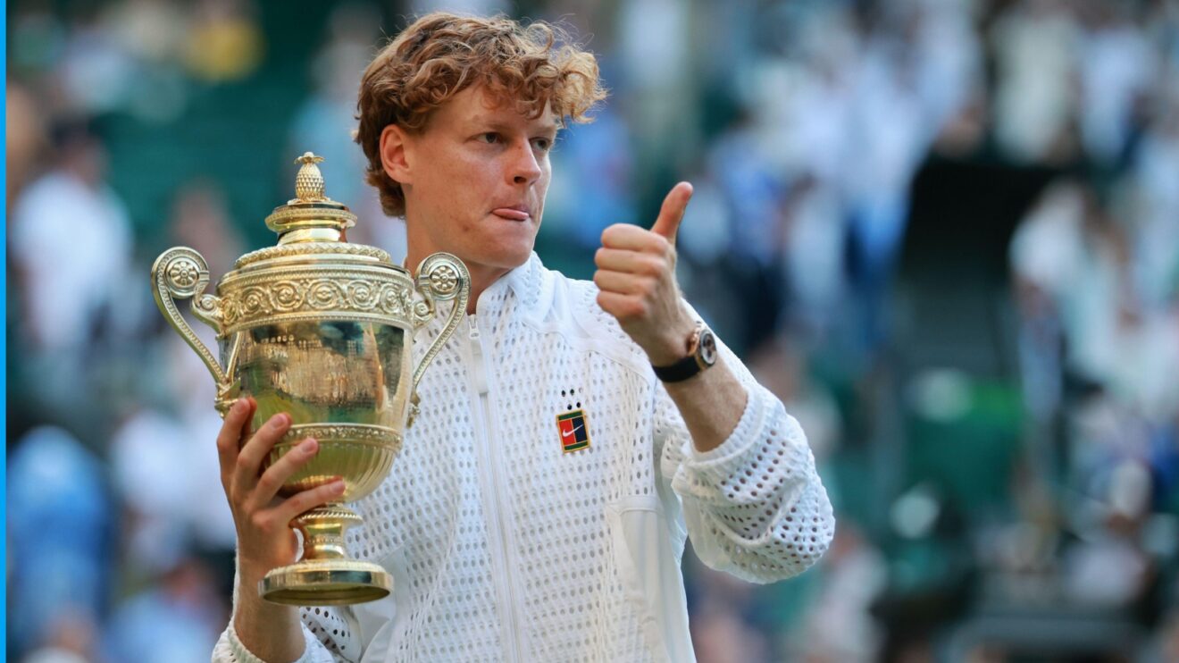 Jannik Sinner holding the Wimbledon 2026 title