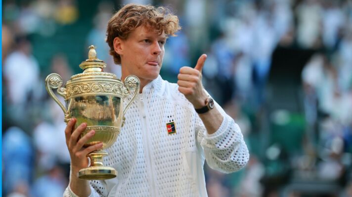 Jannik Sinner holding the Wimbledon 2026 title