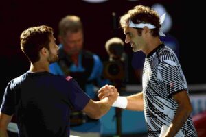 Pictured: Noah Rubin shakes hands with Roger Federer at the Australian Open