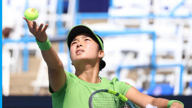 Pictured: Alex Eala serves during her match