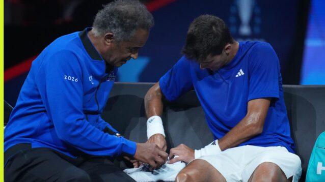 Pictured: Yannick Noah and Rafael Jodar try to fix the Spaniard's shoelaces at Laver Cup